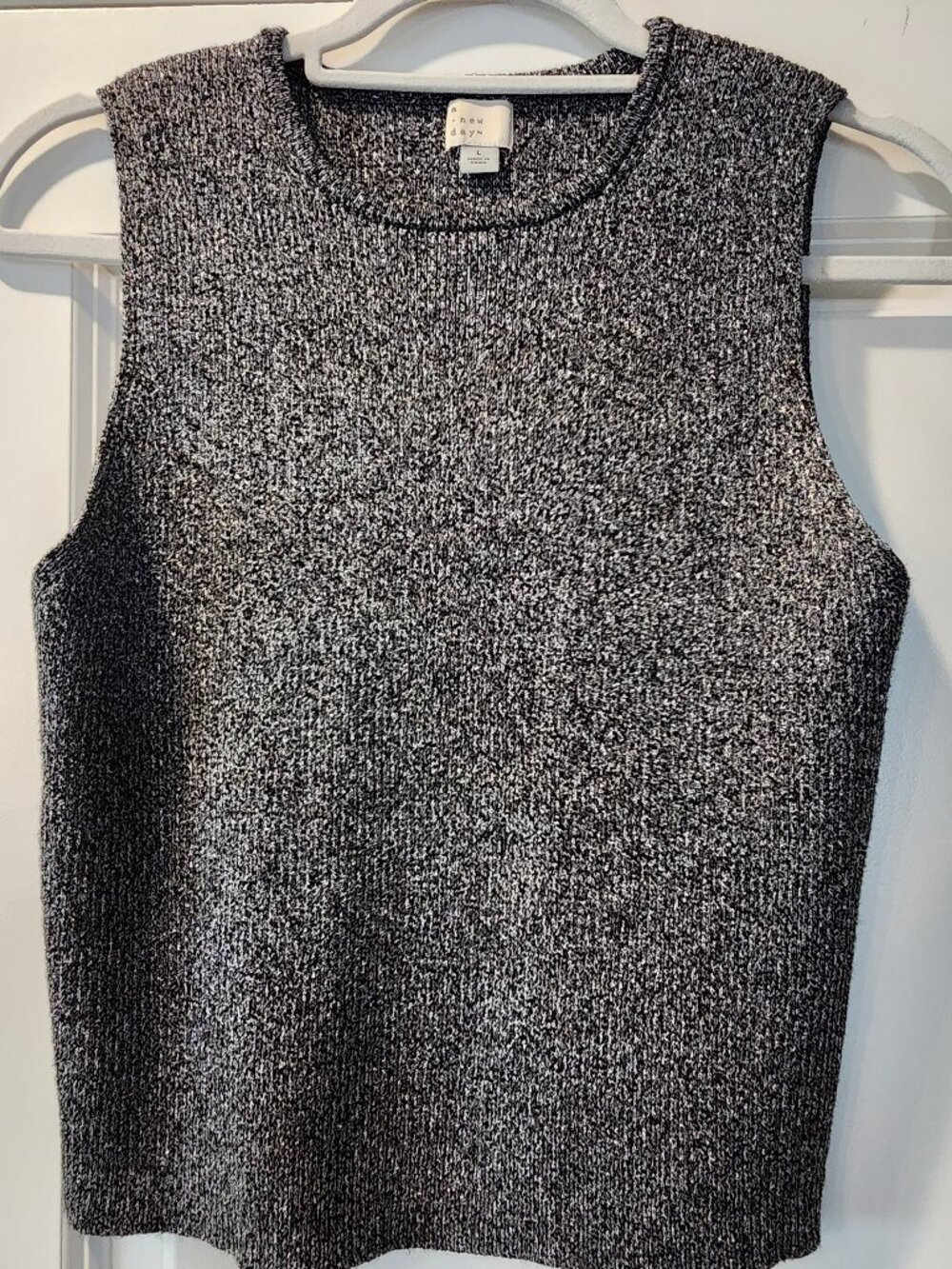 A.New Day Black with silver sleeveless knitted shirt size Large.  ITEM 0320261BL